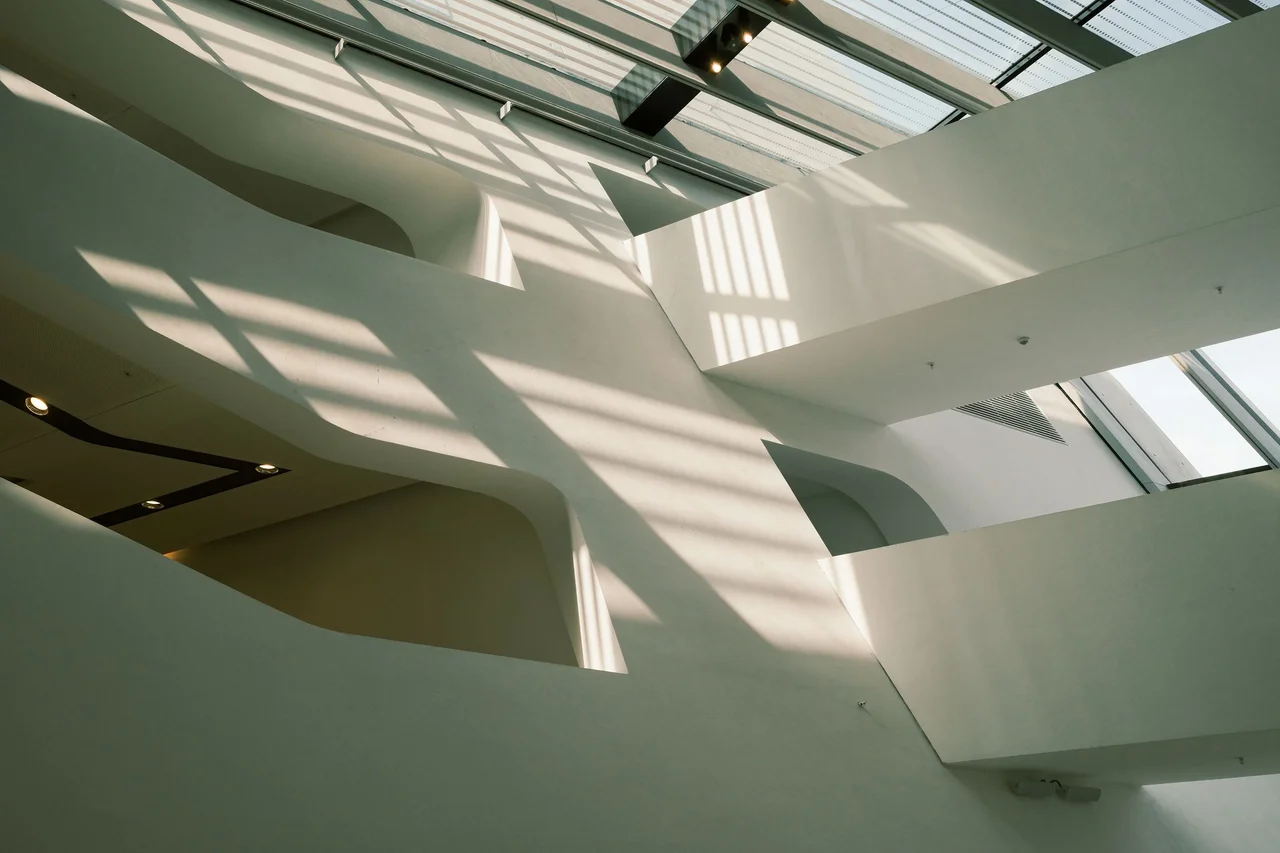 Daylight falling across the clean structural lines of a contemporary building